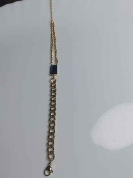 Modern Mixed-Chain Gold Bracelet with Black/Emerald Baguette Gem