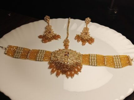 Golden Crystal Beaded Choker Jewelry Set with Peach Drops and Maang Tikka