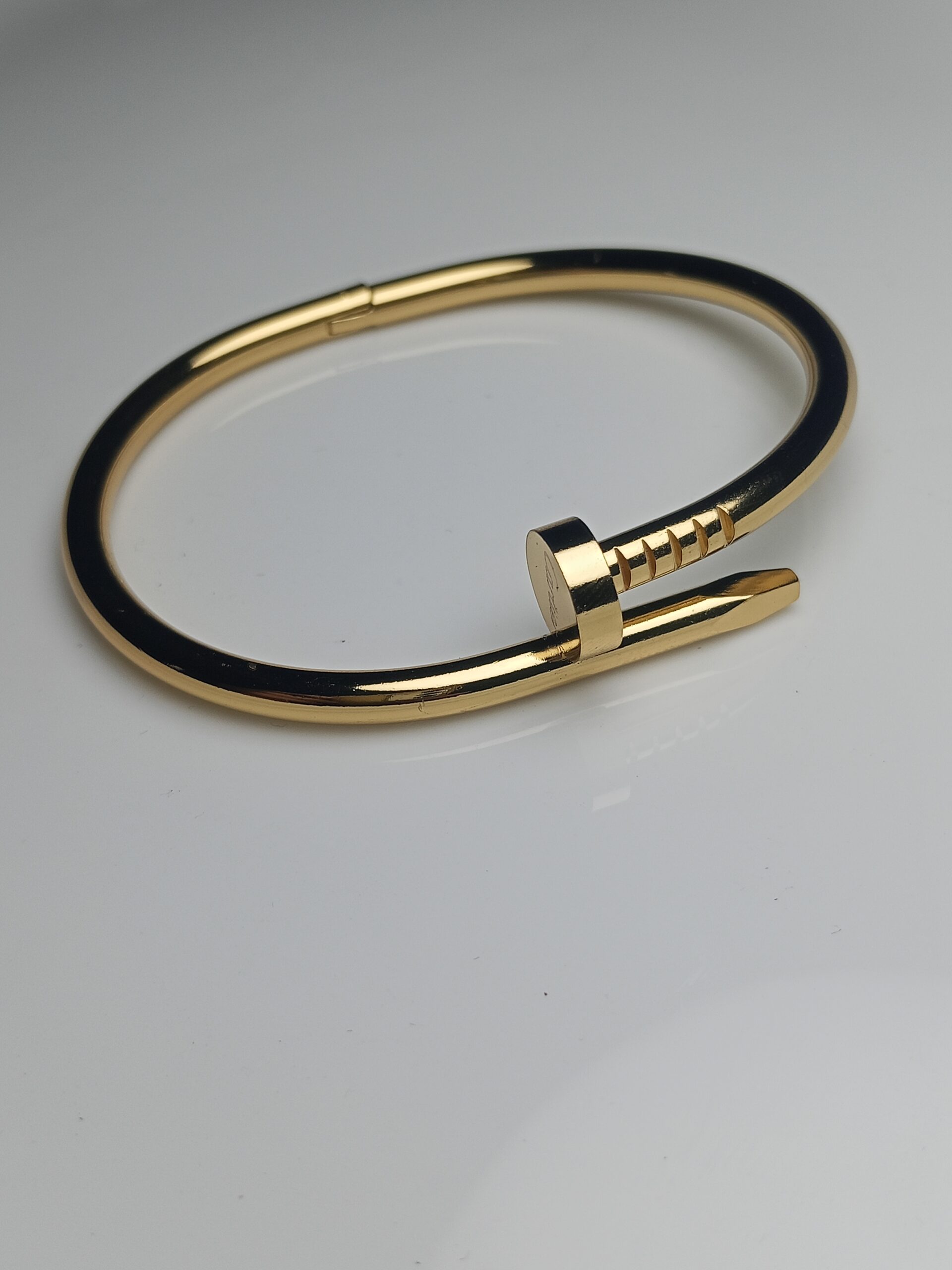 Iconic Modern Nail Design Bangle Bracelet in High-Shine Gold Finish