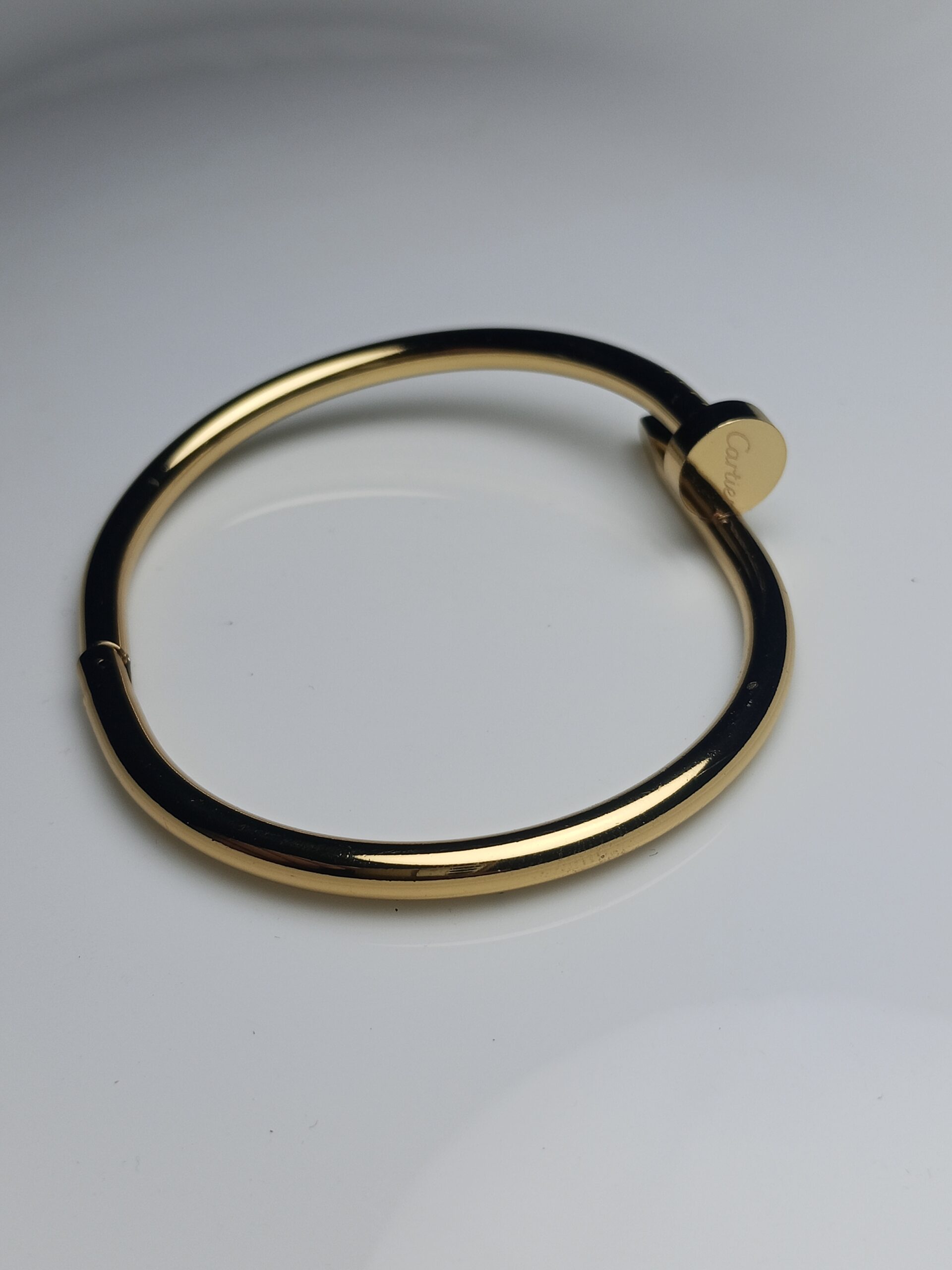 Iconic Modern Nail Design Bangle Bracelet in High-Shine Gold Finish