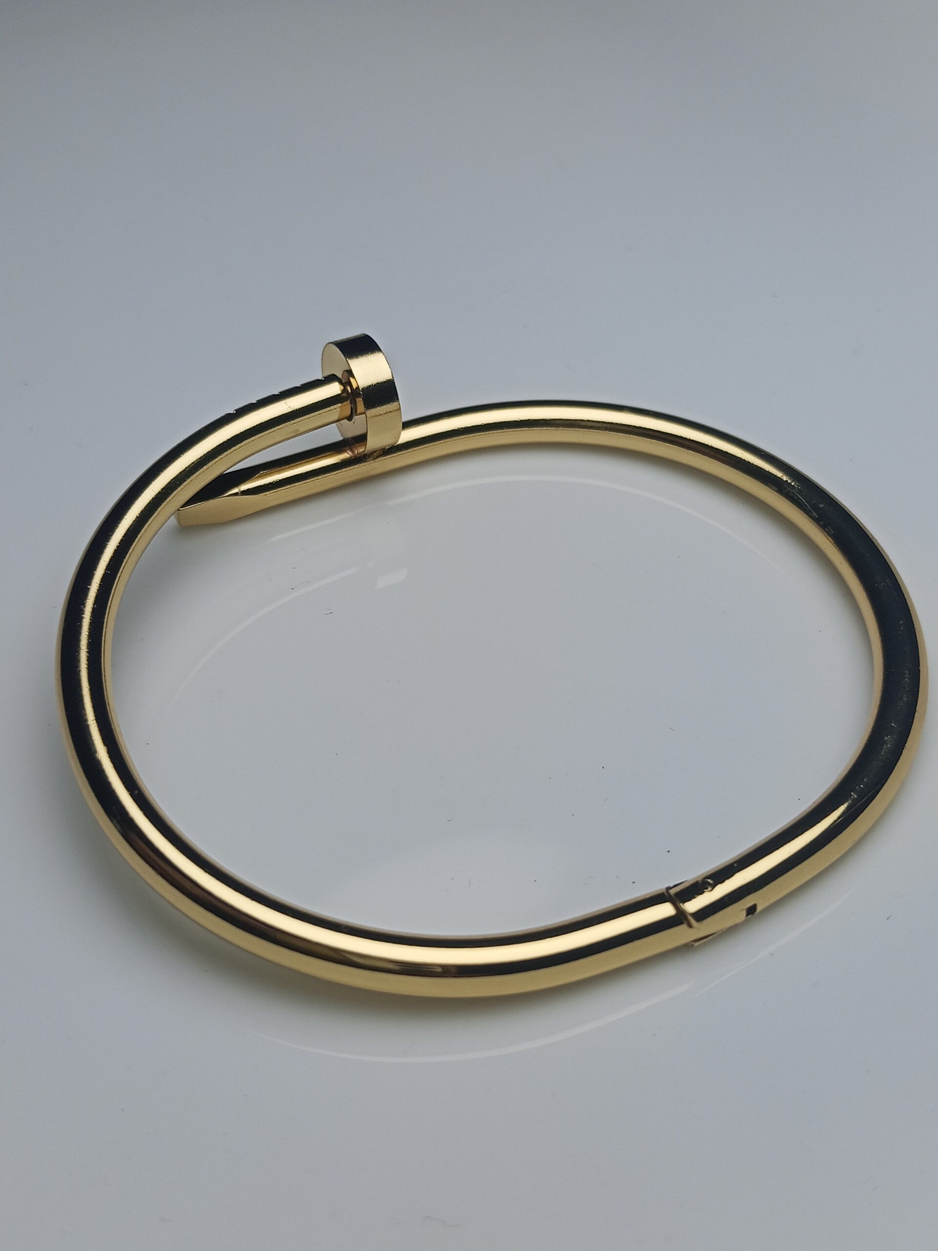 Iconic Modern Nail Design Bangle Bracelet in High-Shine Gold Finish